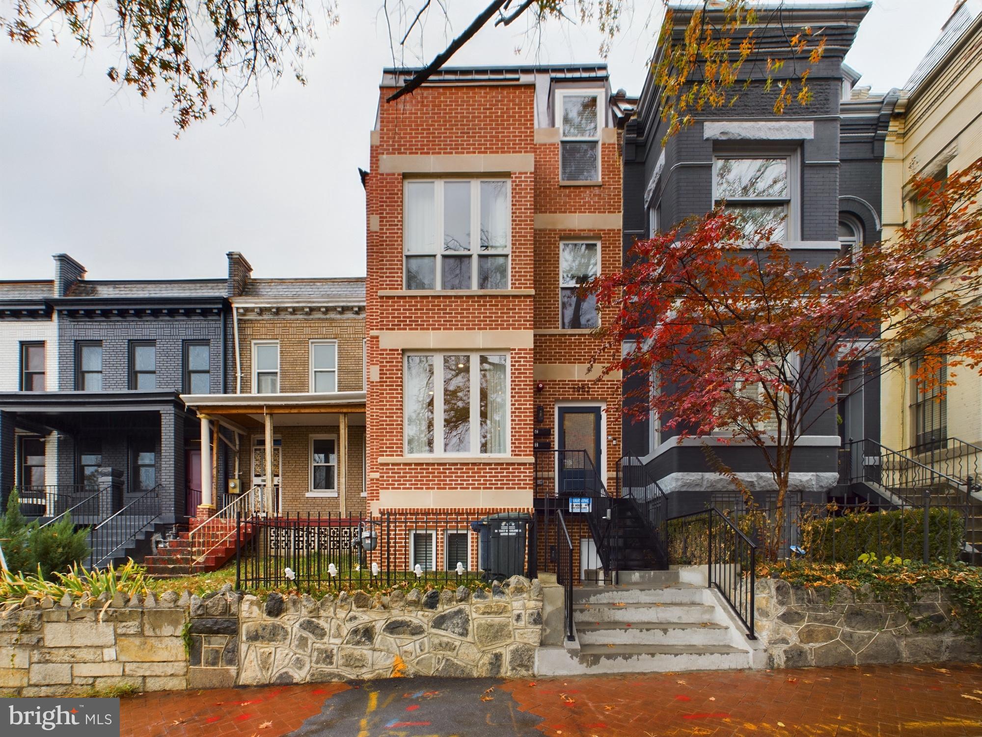 a front view of a building with street view