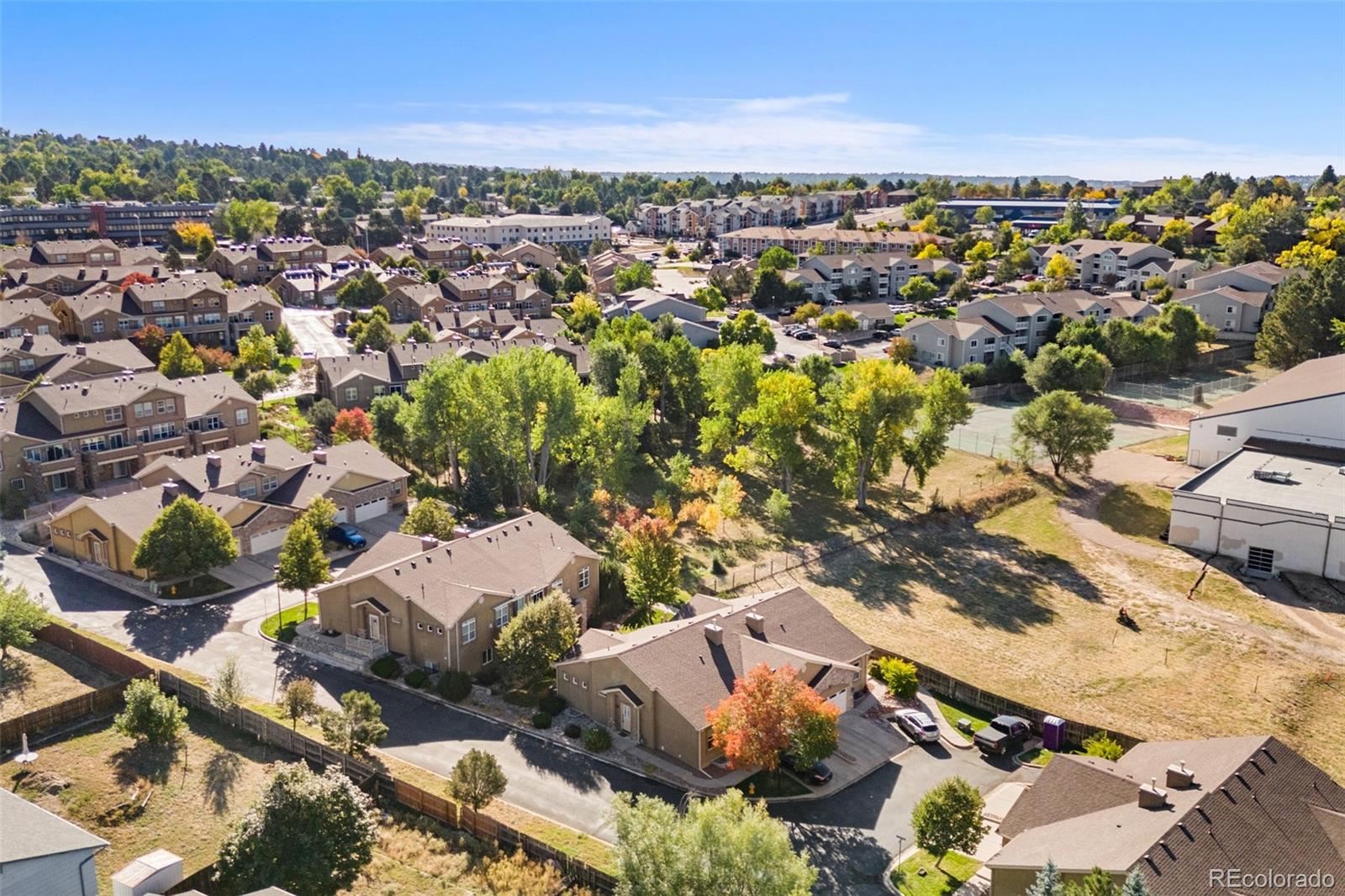 an aerial view of residential houses with outdoor space