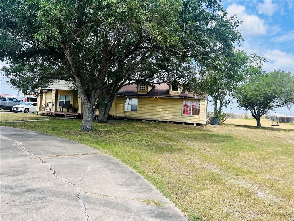 a view of house with outdoor space and tree s