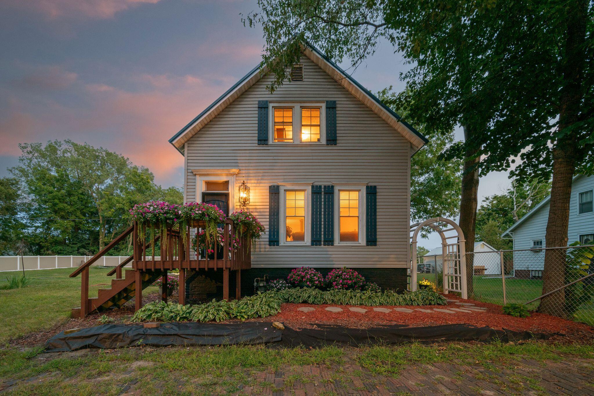 a front view of a house with a yard