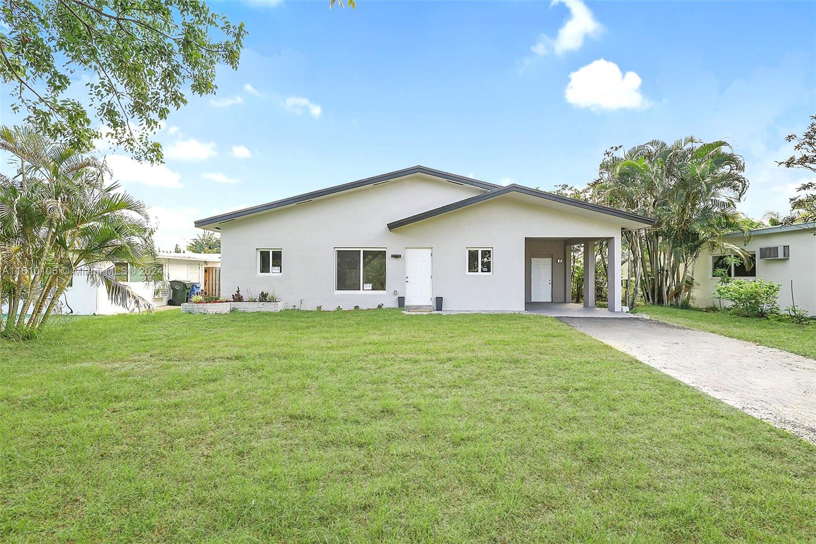 a view of a house with a back yard