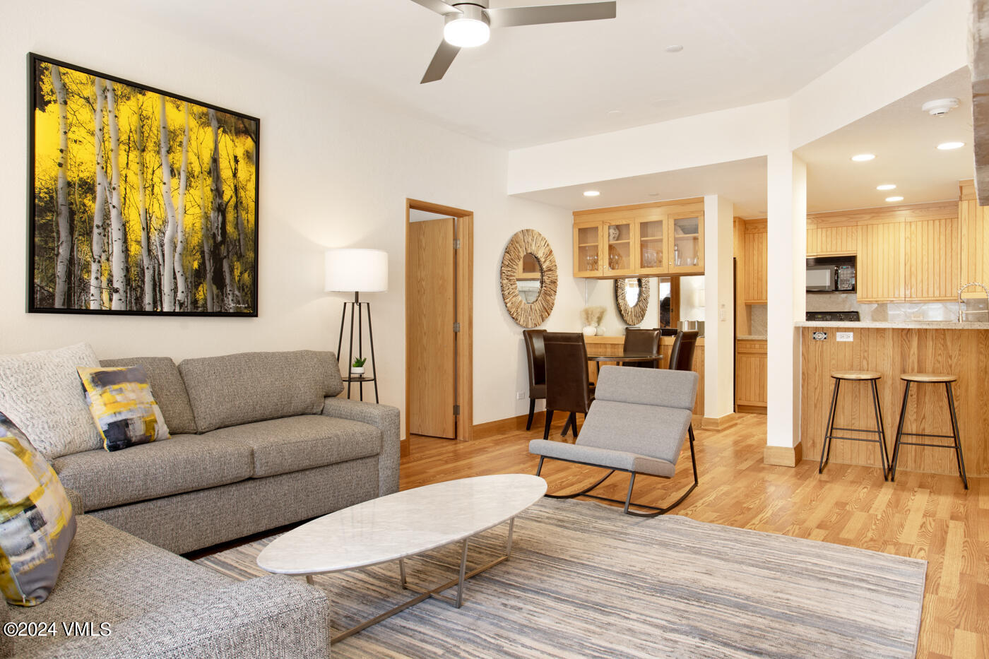 a living room with furniture and a table