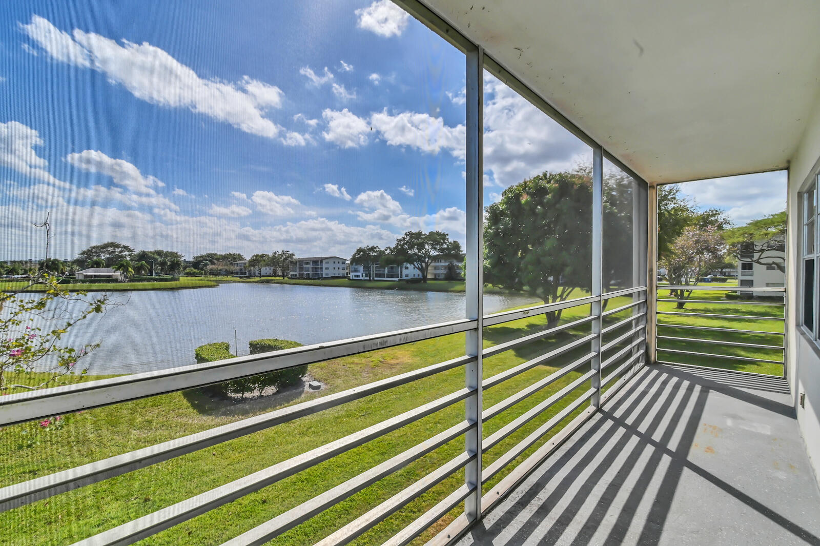 a view of a building with lake view and mountain view