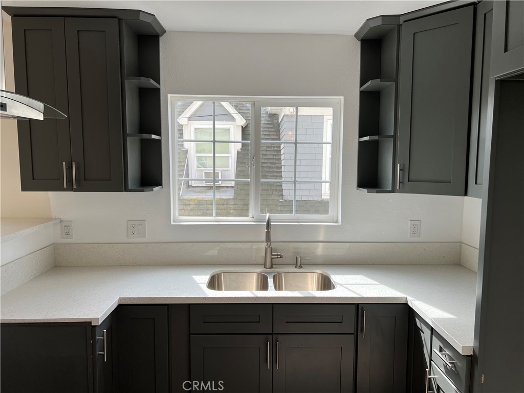 a kitchen with a sink and a window