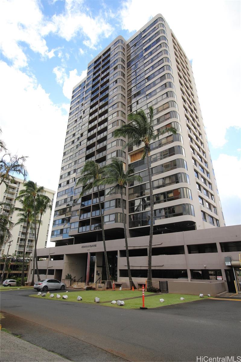 a tall building sitting on the side of a street