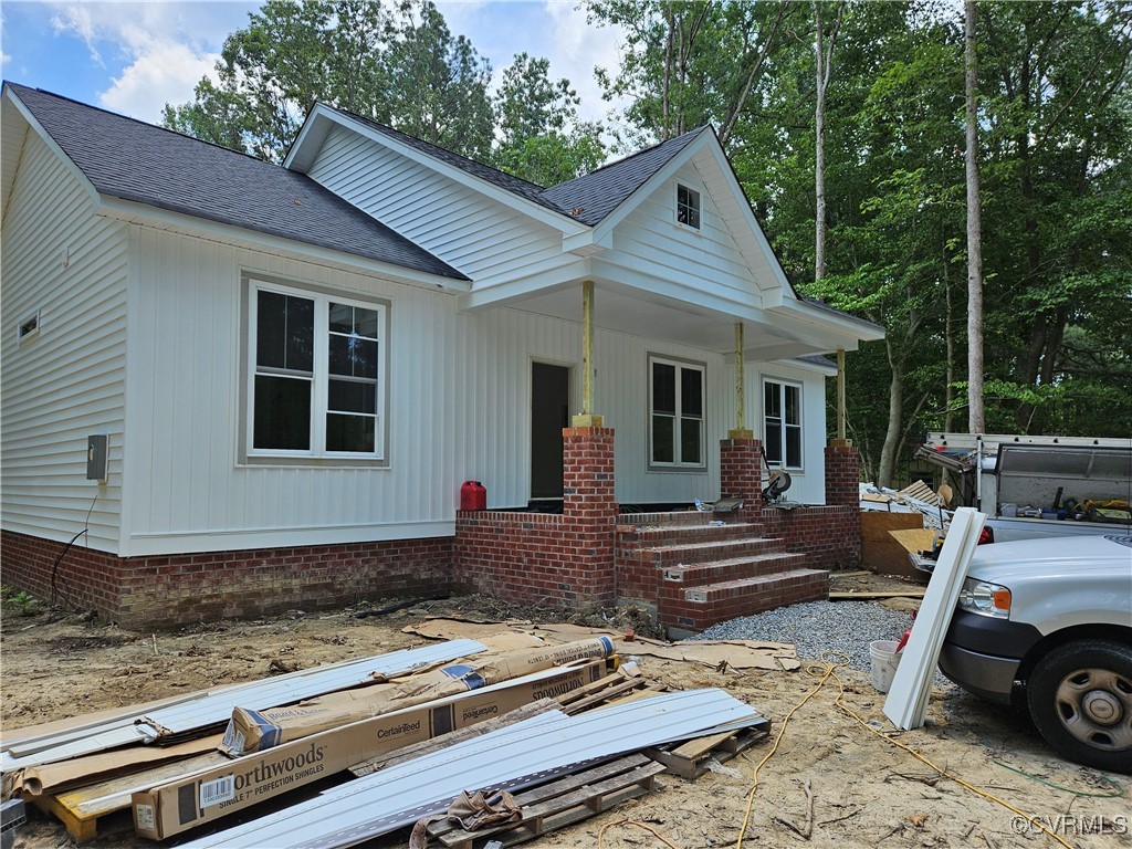 View of front of house featuring covered porch