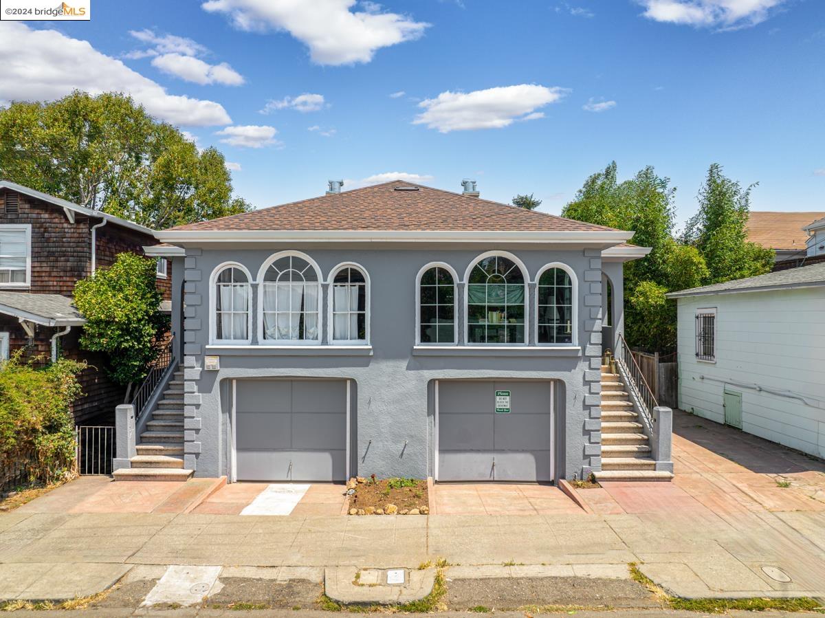 a front view of a house with a garage