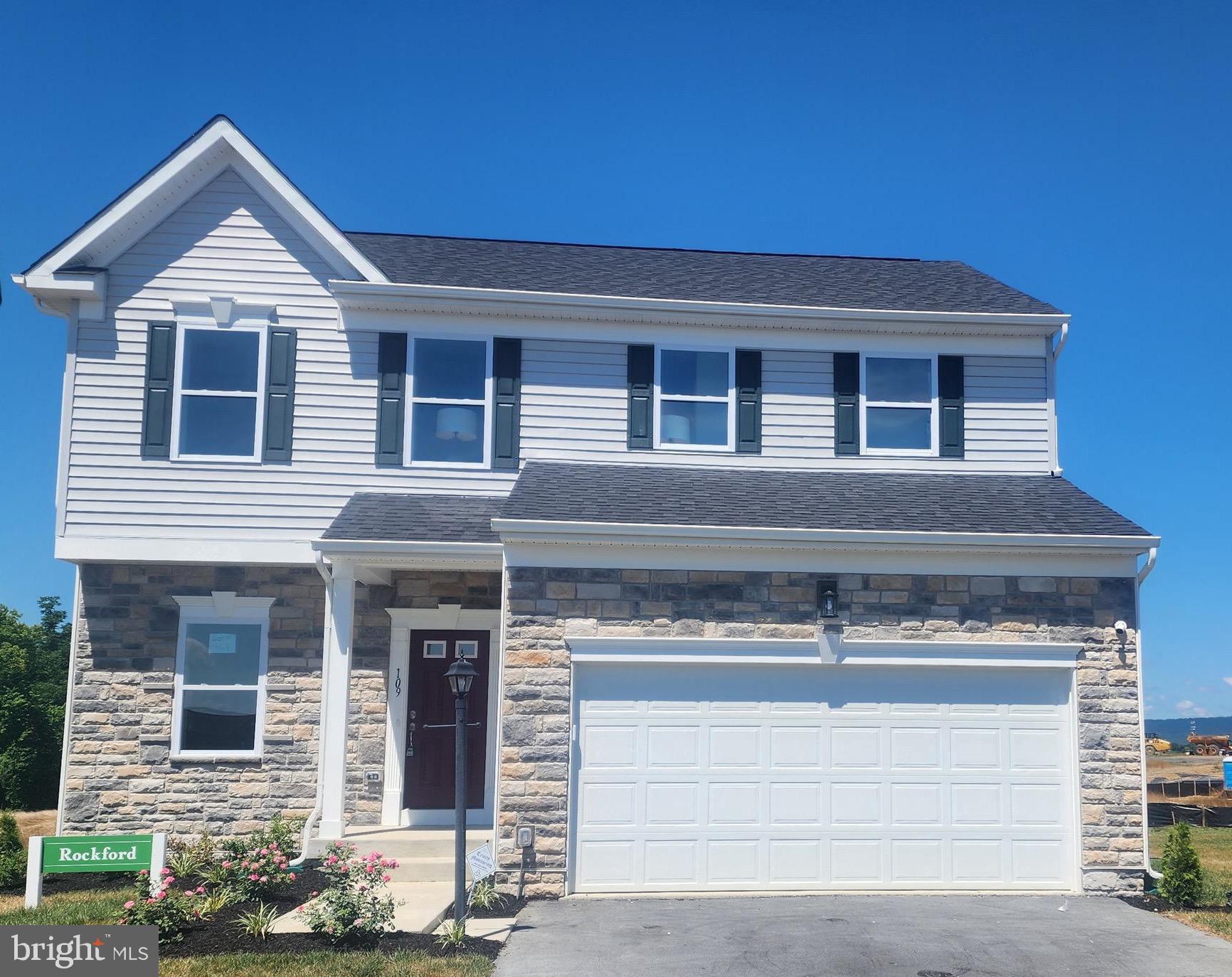 a front view of a house with yard