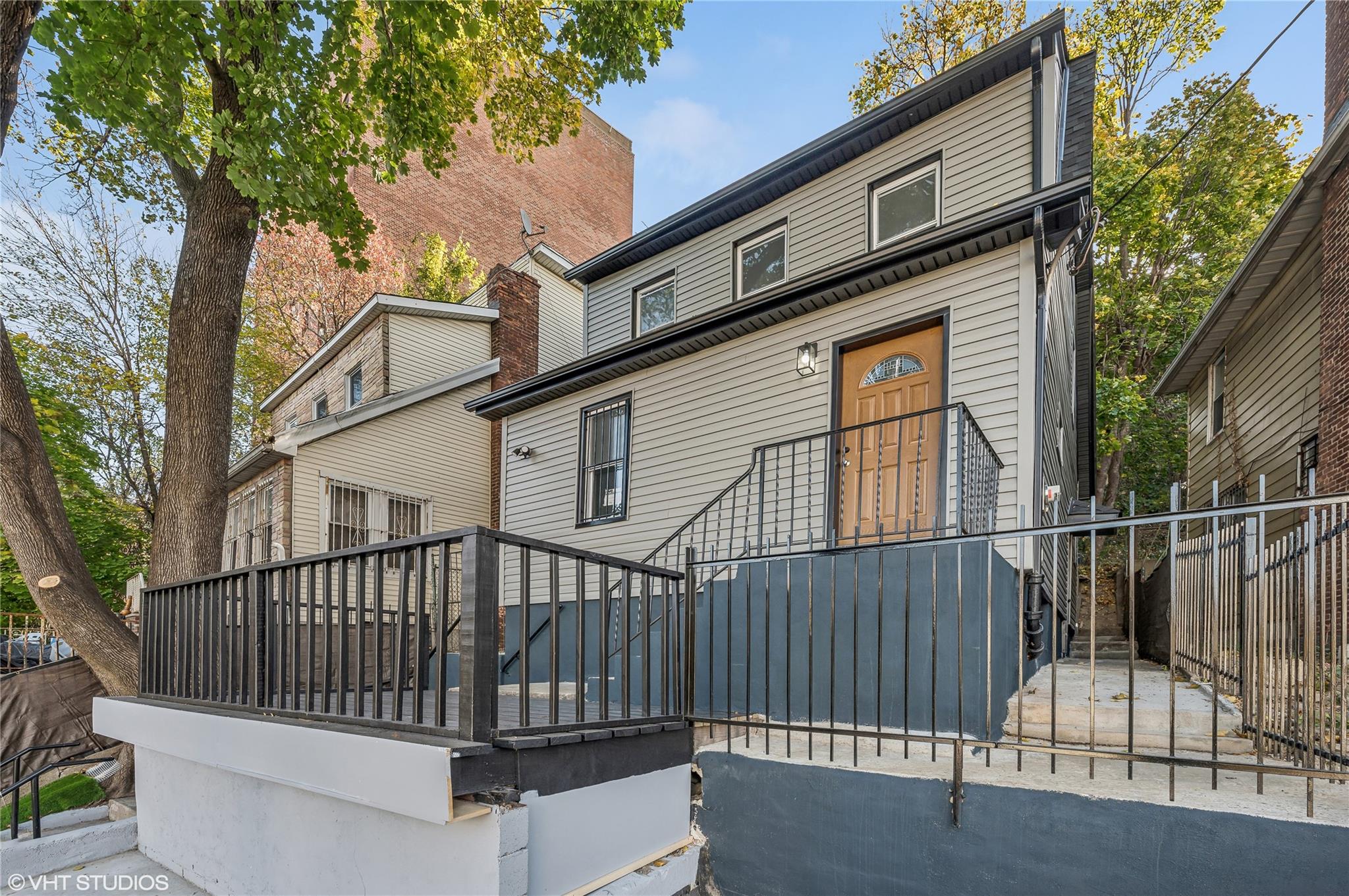 a view of a house with a wooden deck