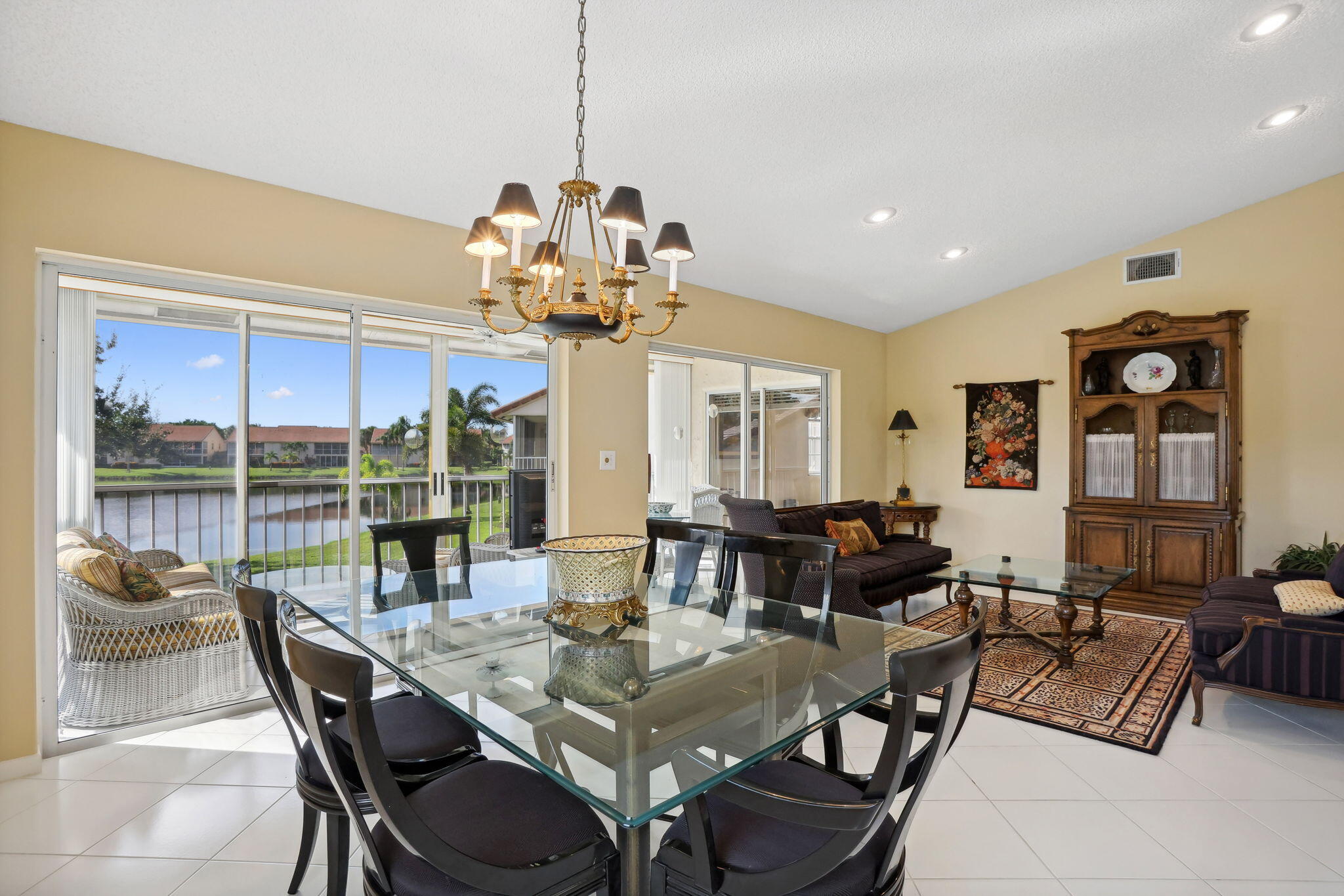 a view of a dining room with furniture wooden floor and chandelier