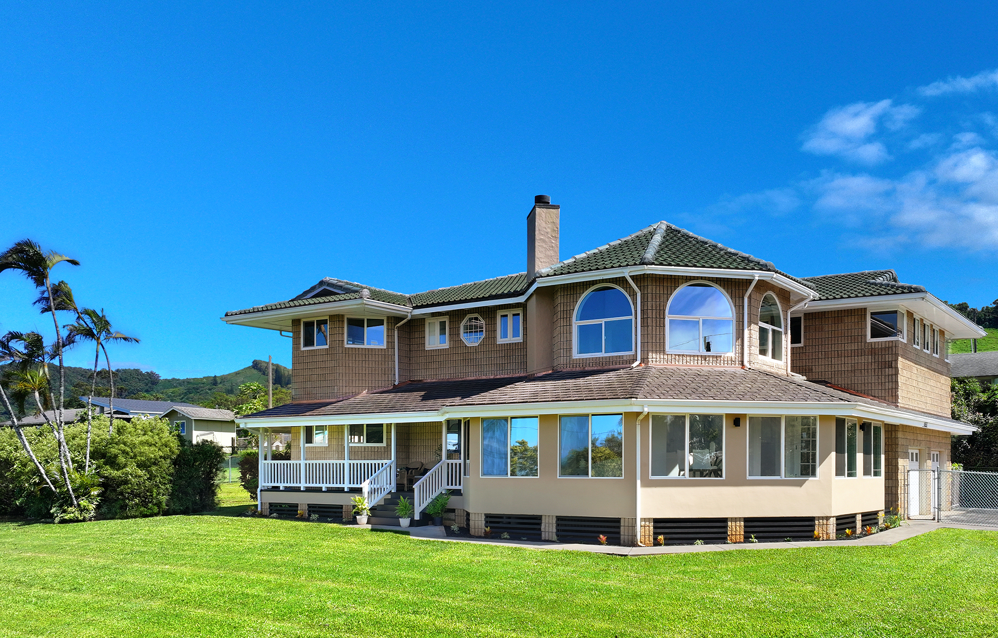 a front view of a house with a garden