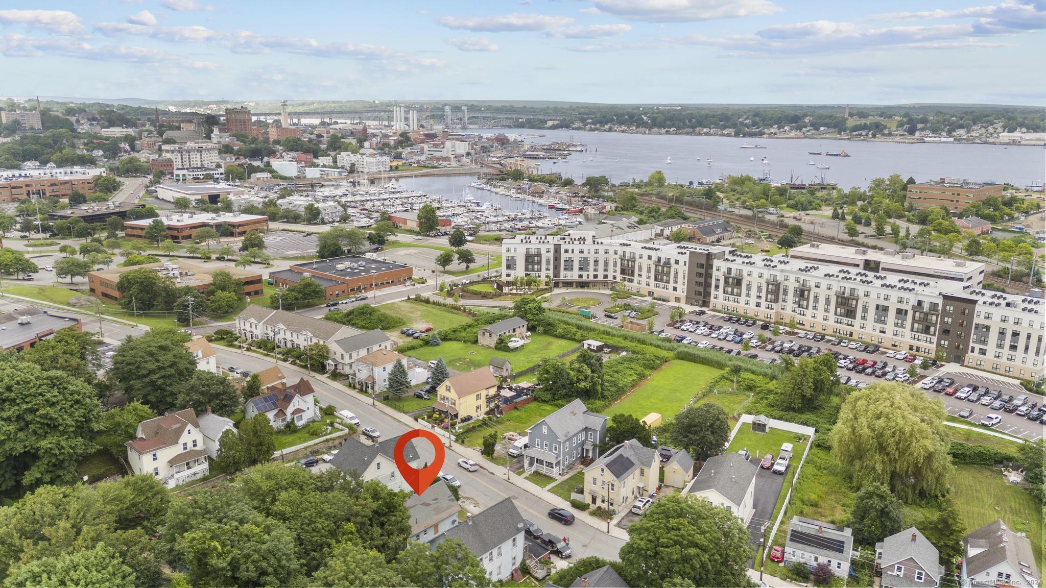 an aerial view of residential building and lake