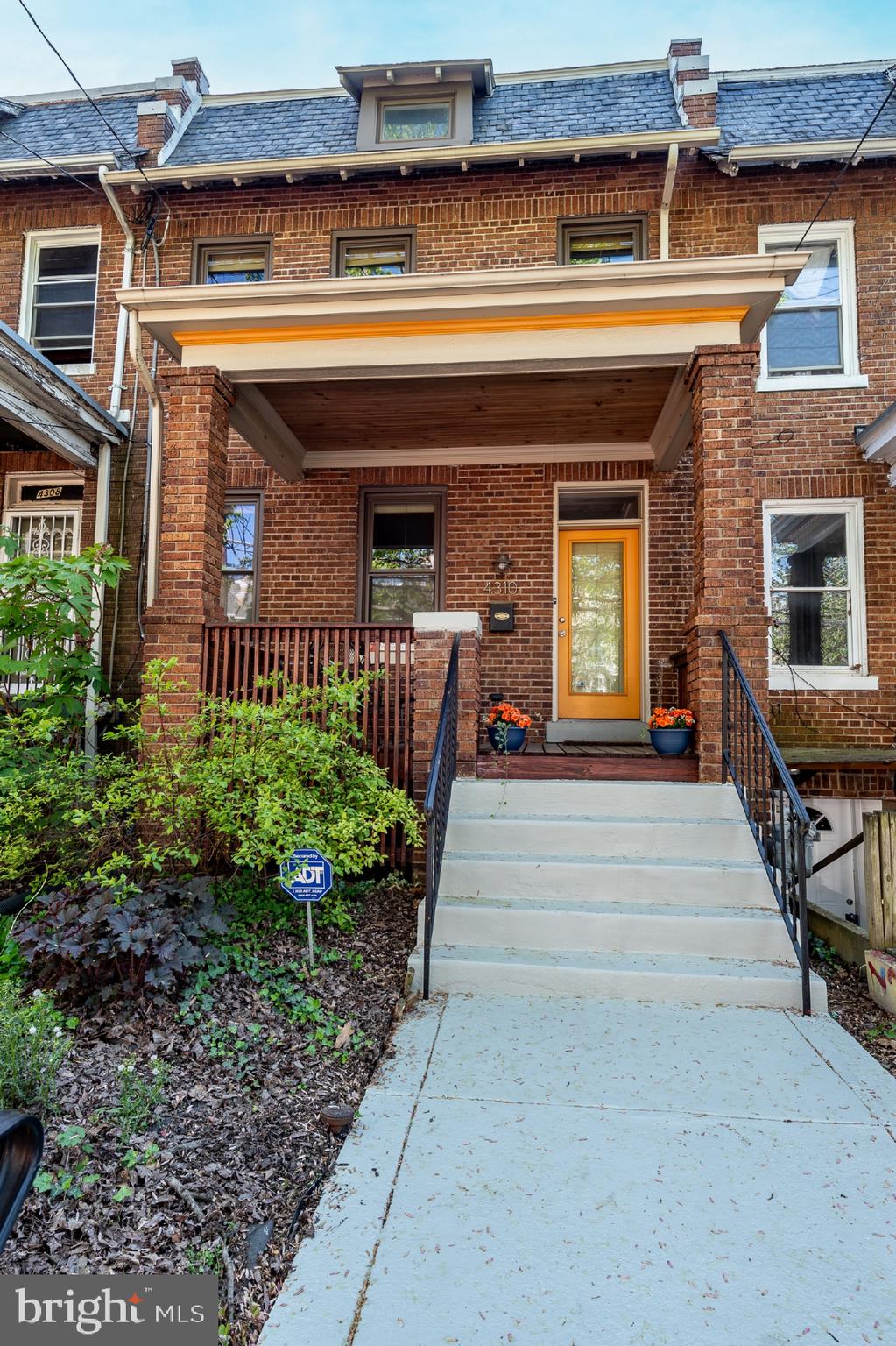 a front view of a house with a porch