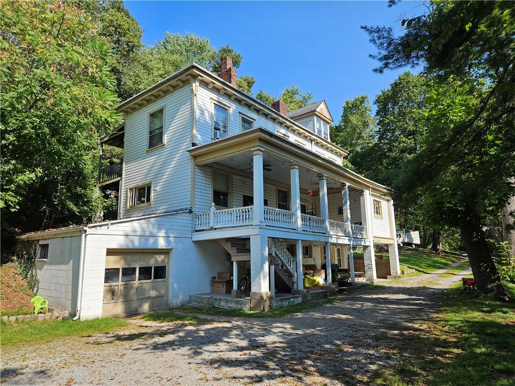 1003 Middle Road - Shaler. One of the units has a large porch. There is an attached garage