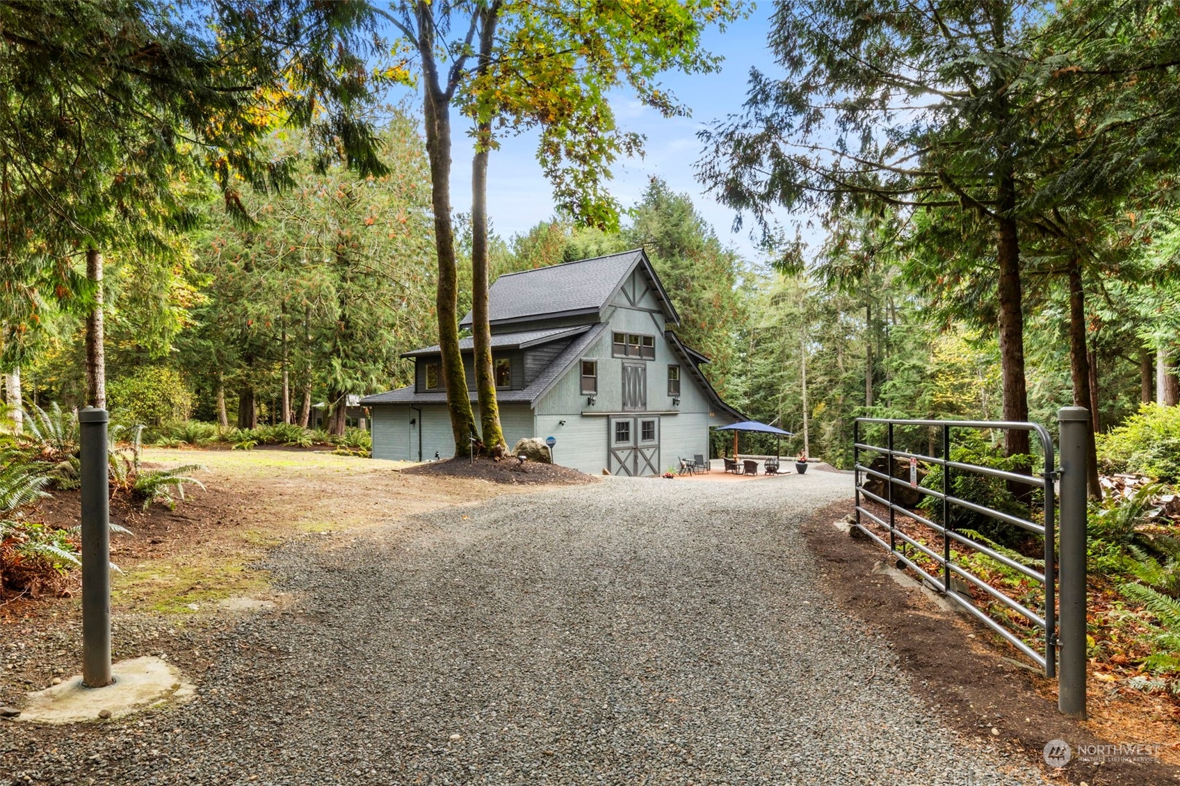 a view of a house with a tree in the background