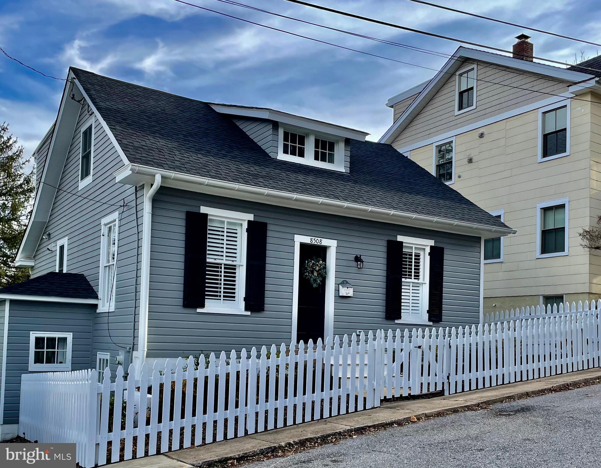 a front view of a house with a porch