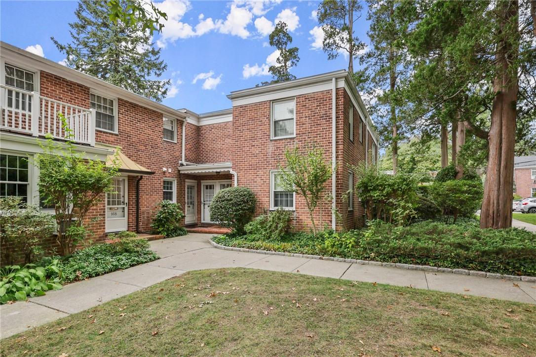 a brick house with a large windows