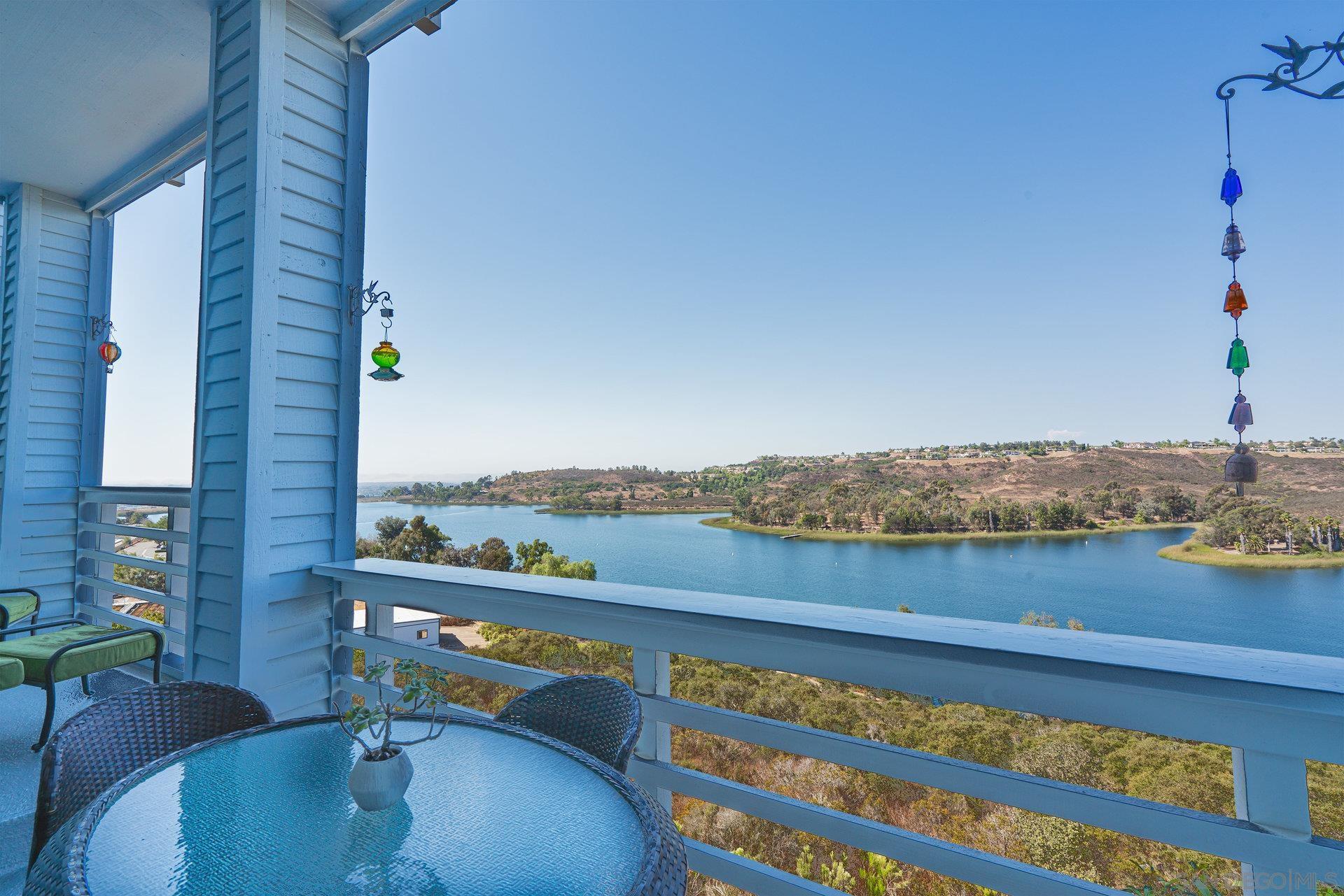 a view of a balcony with lake view and mountain view