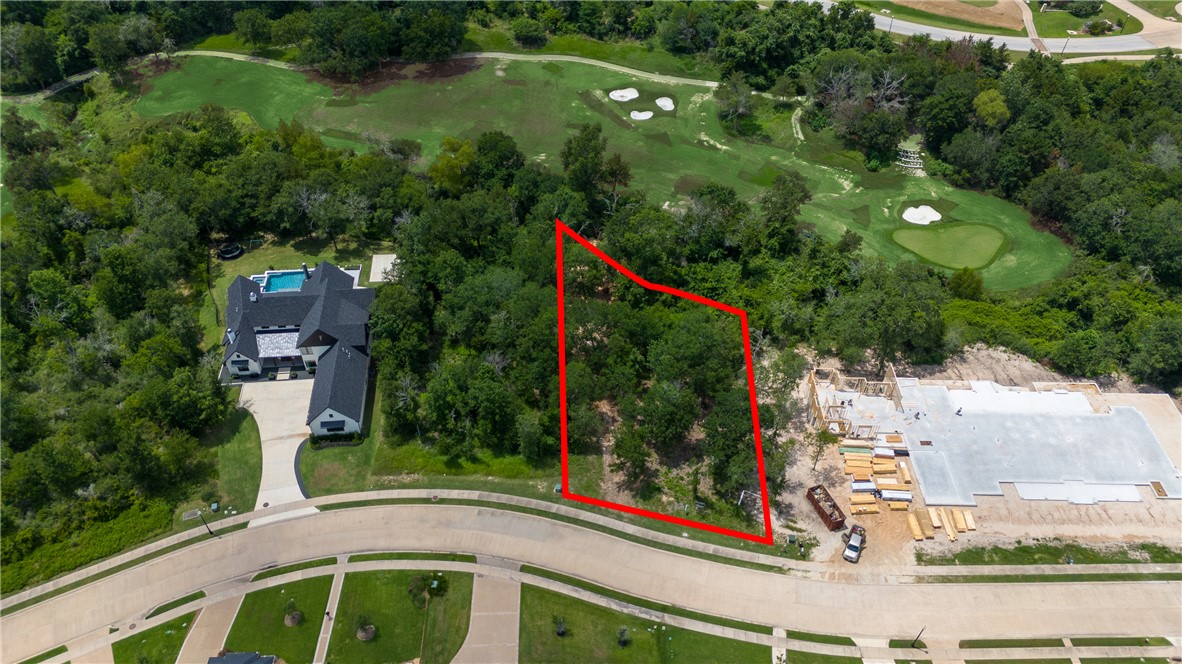 an aerial view of multiple houses with yard