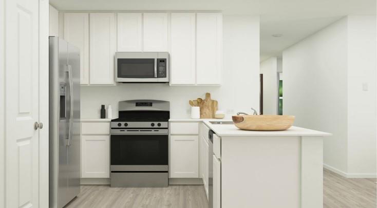 a kitchen with a stove and a microwave