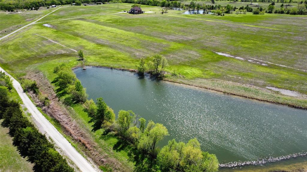 a view of a lake with a yard