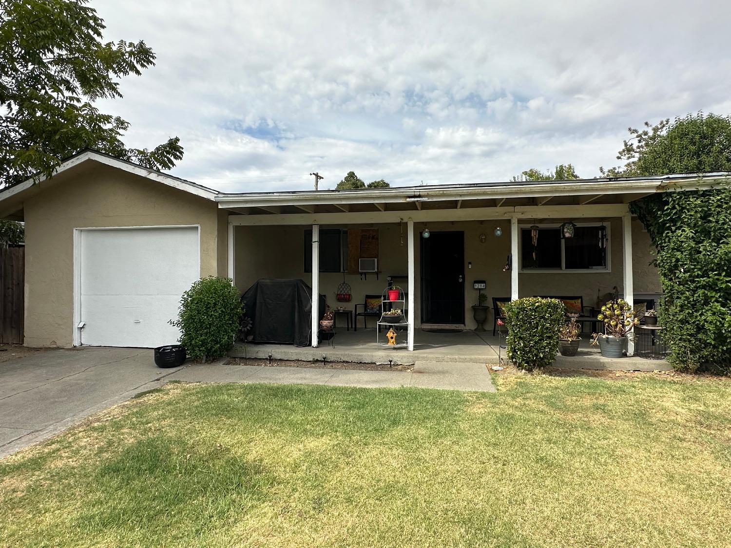 front view of a house with a patio