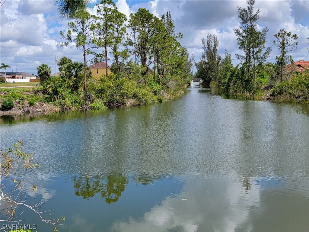 an aerial view of a houses with a lake view