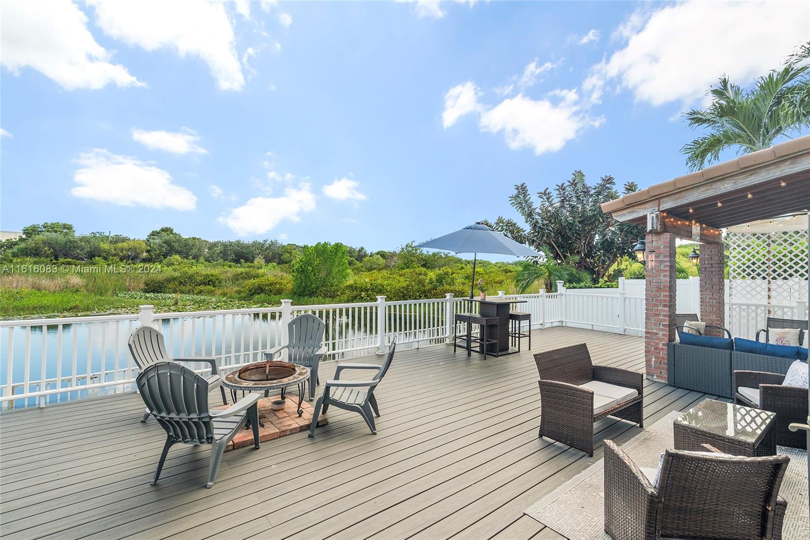 a view of a roof deck with furniture