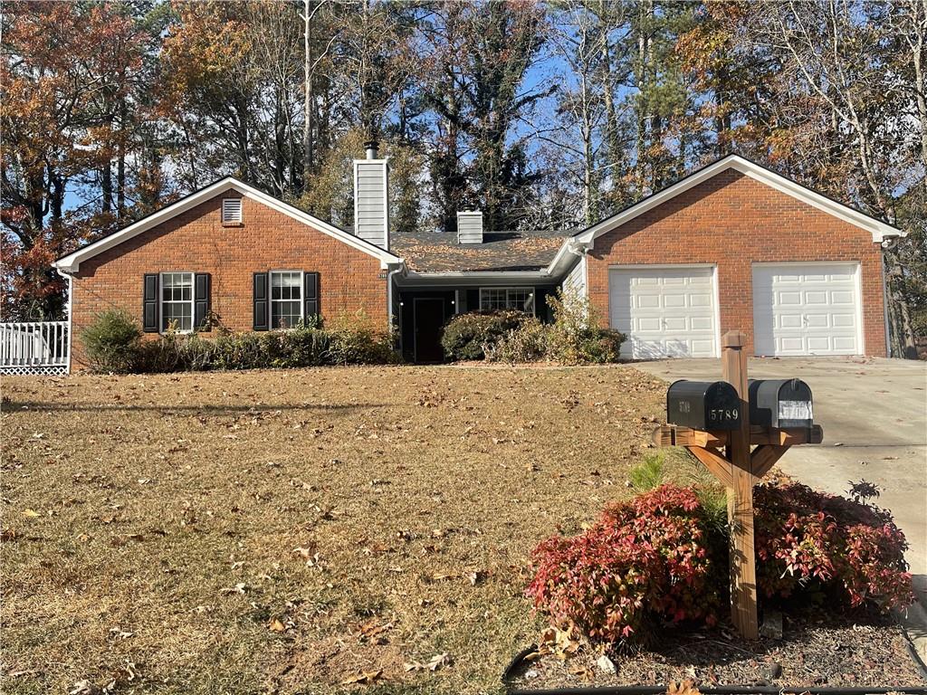 a front view of a house with yard