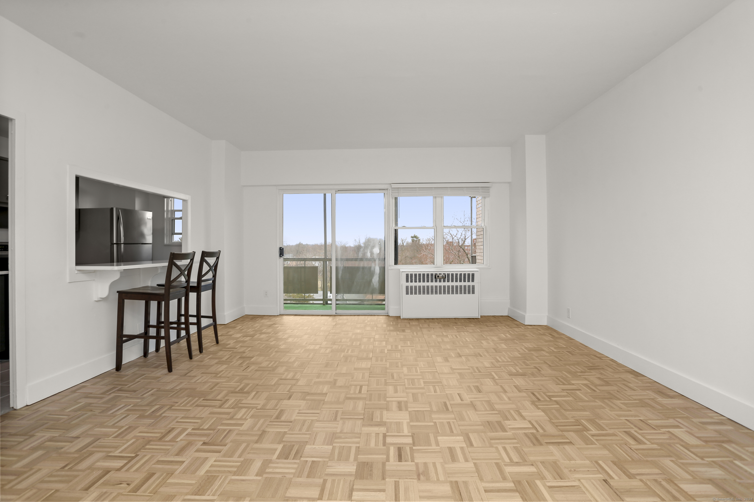 a view of livingroom with furniture and floor to ceiling window