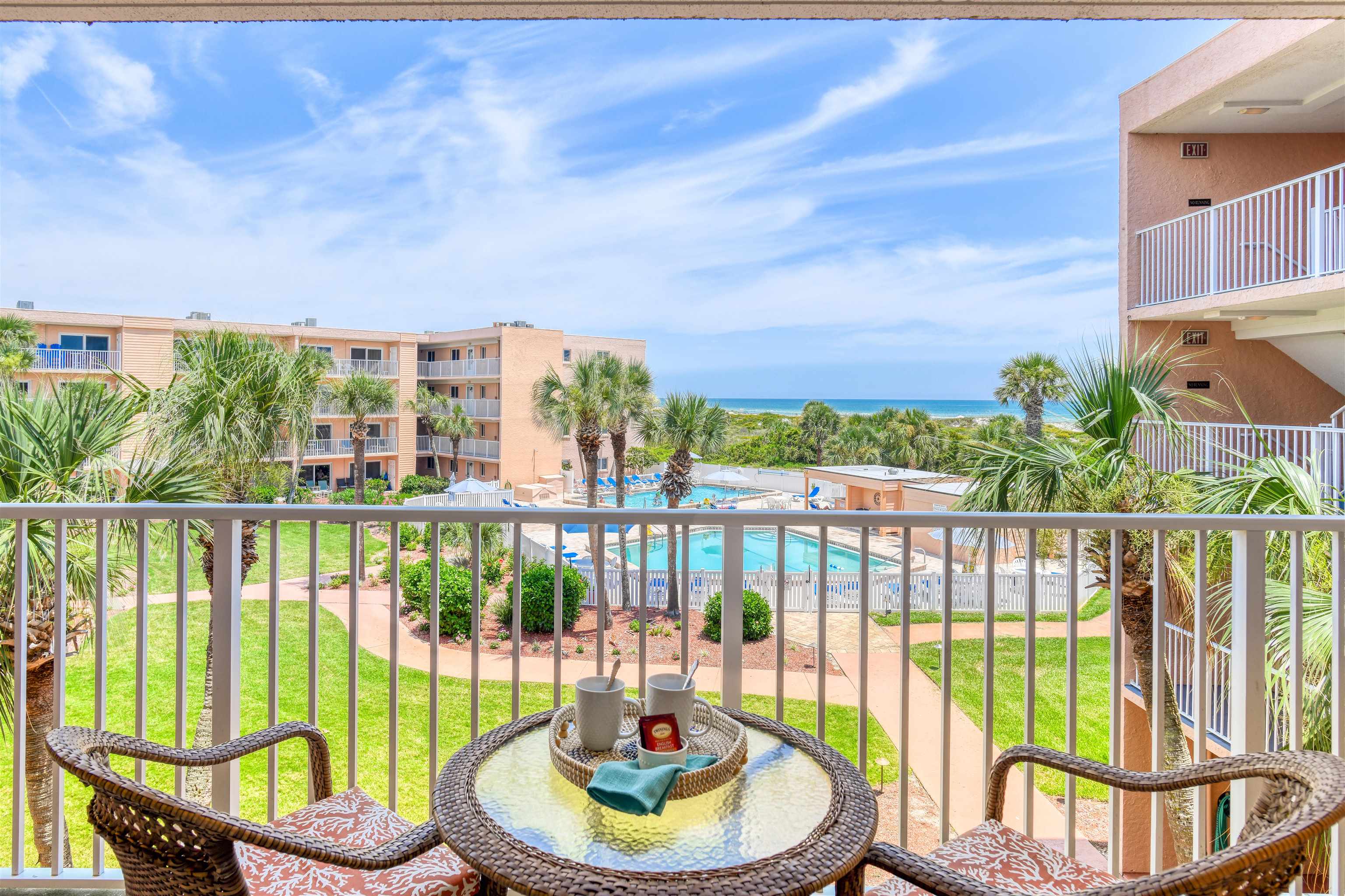 a view of a balcony with lake view and a potted plant