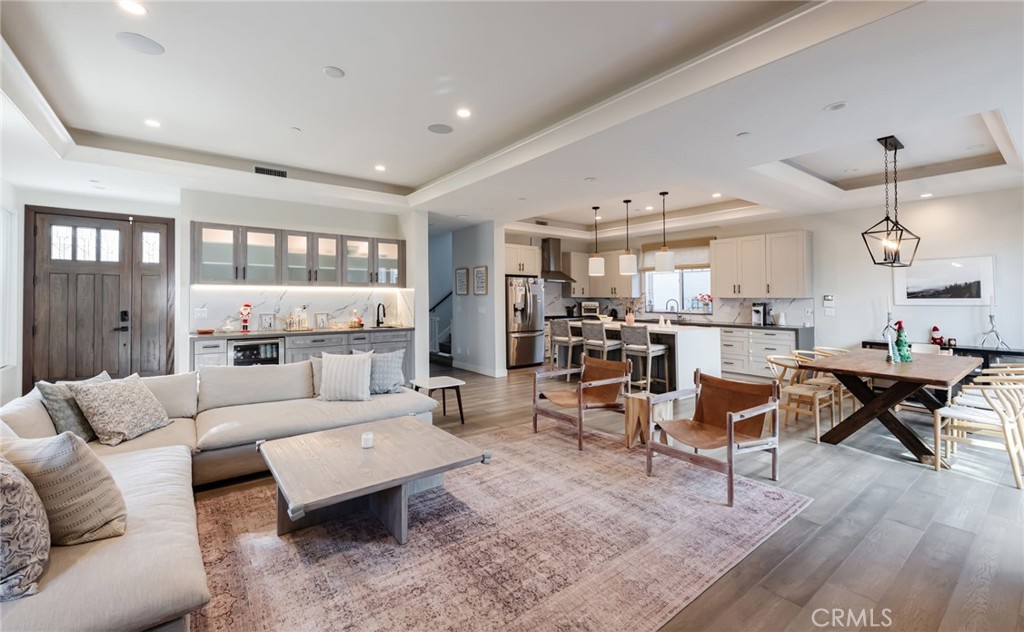 a living room with furniture and kitchen view