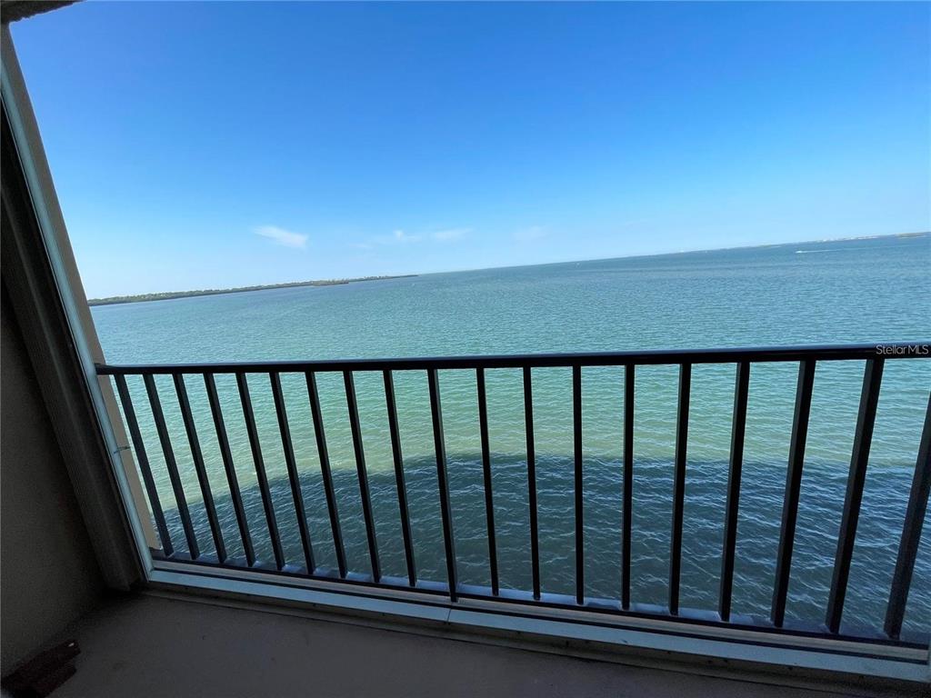 a balcony view with iron fence