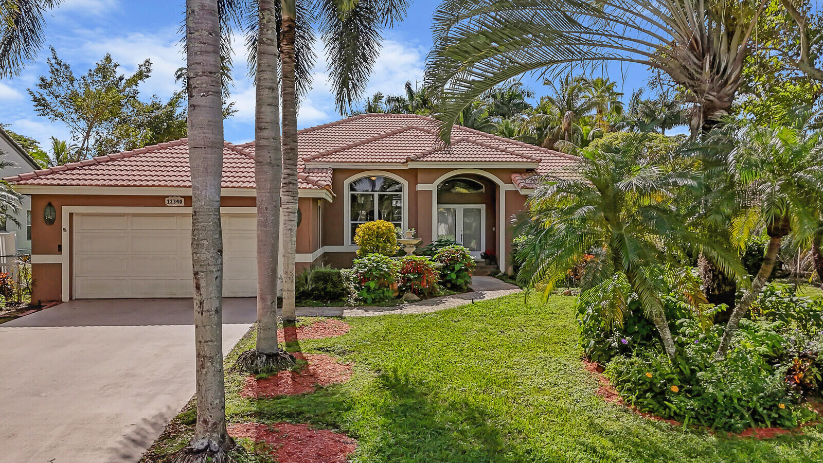 a front view of a house with yard