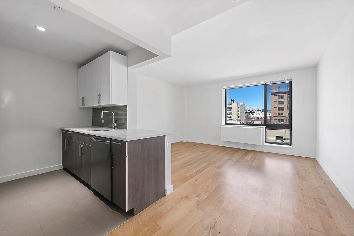 a kitchen with stainless steel appliances a stove and cabinets