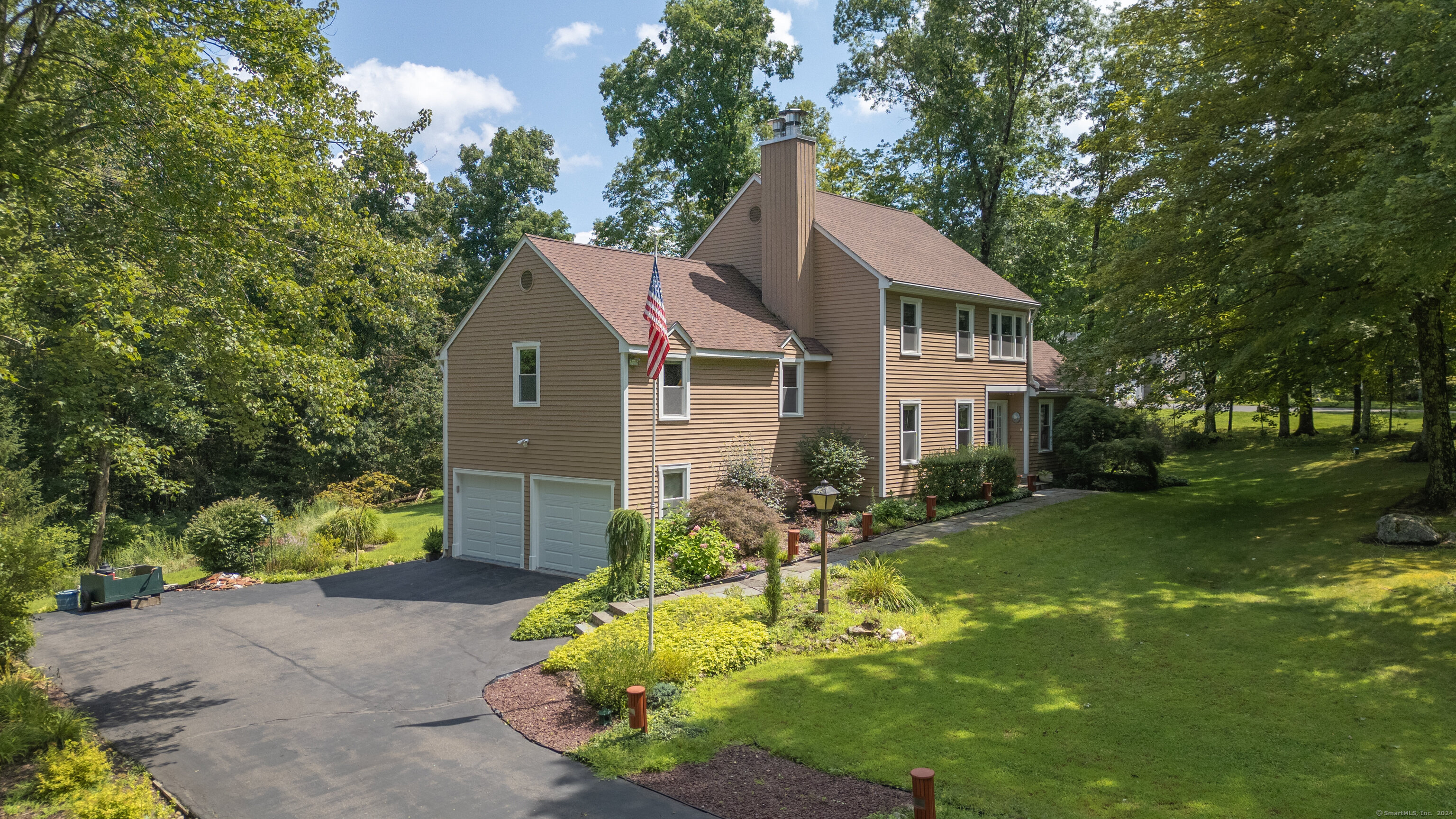 a front view of a house with garden