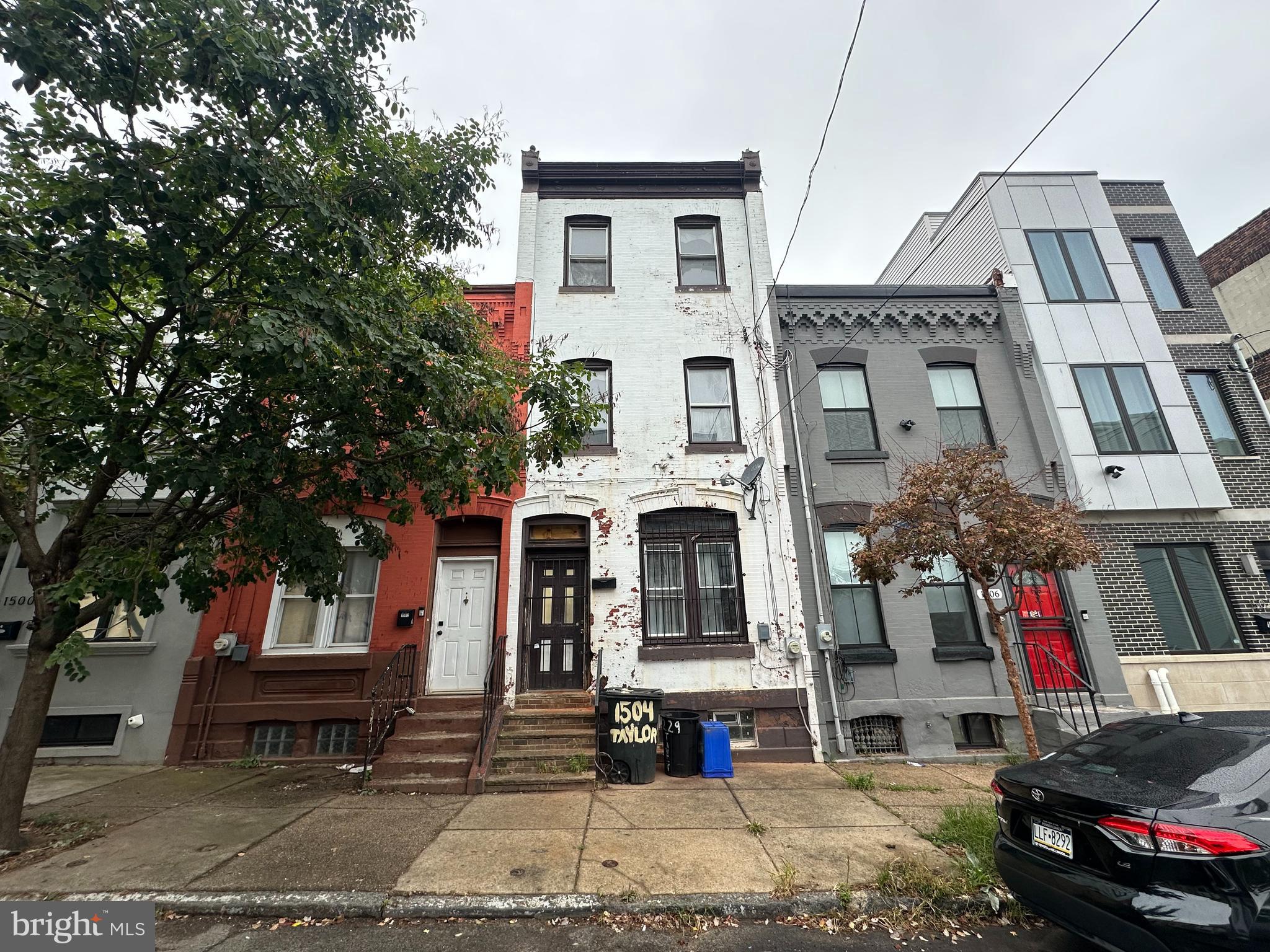 a view of multiple houses with a street