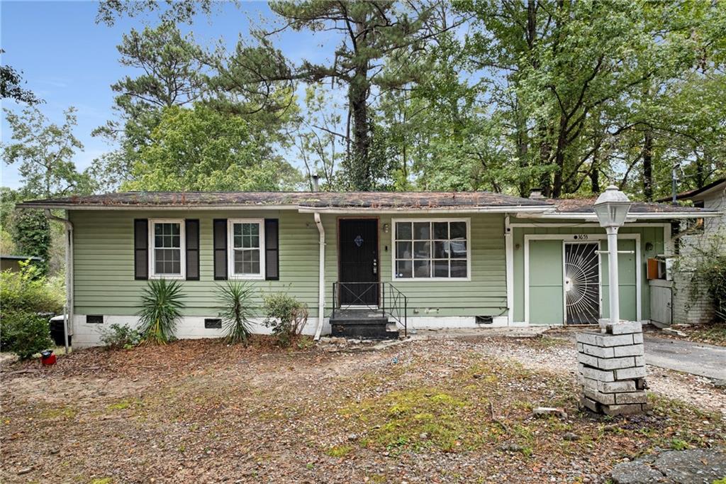 front view of a house with a yard