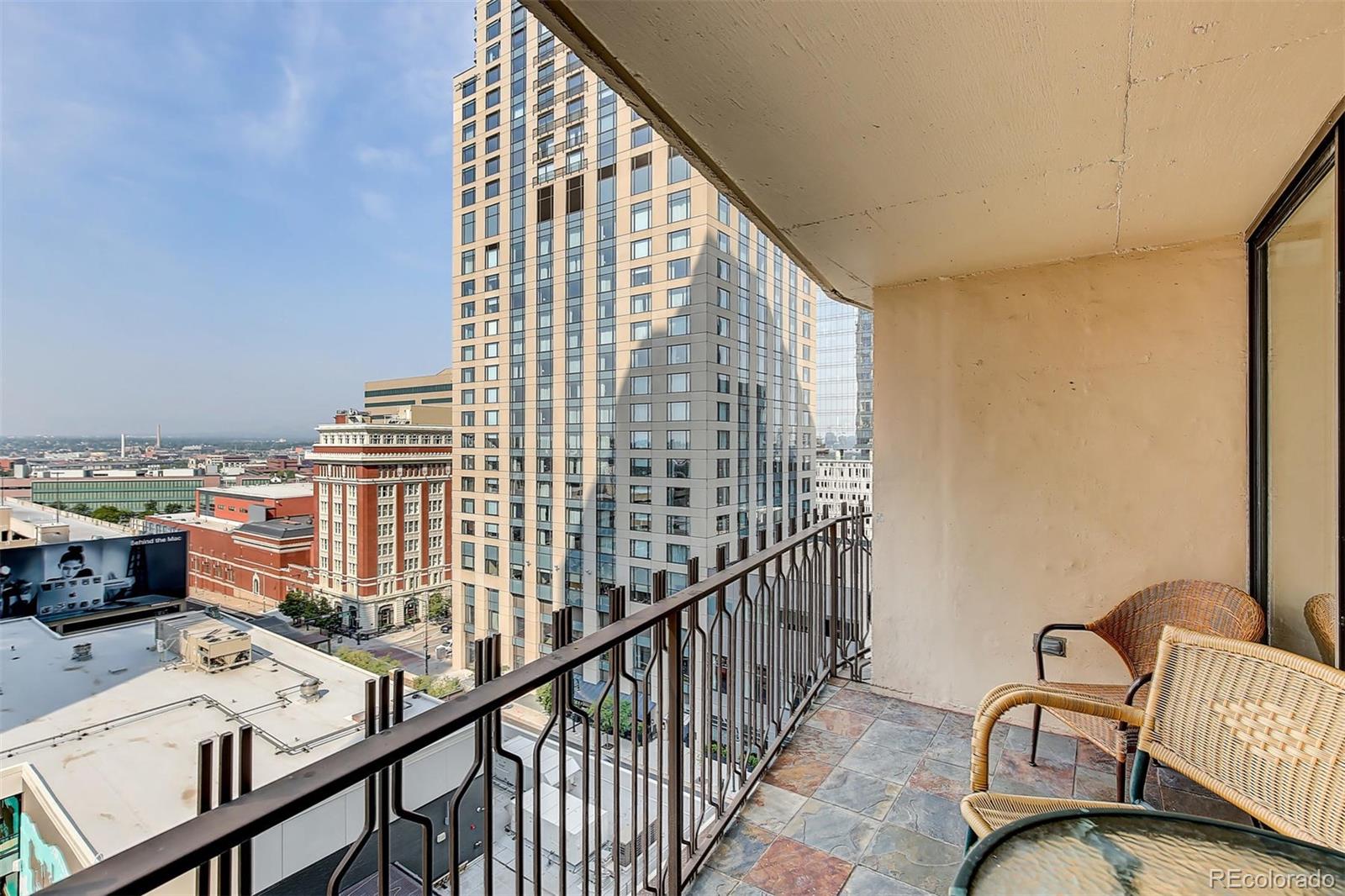 a view of a balcony and furniture