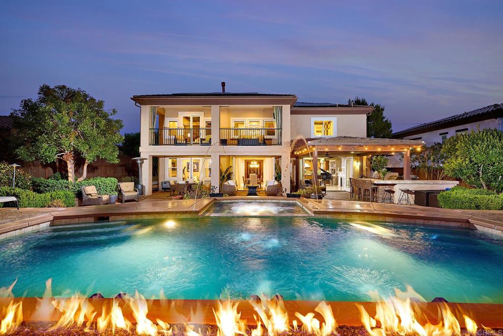 a view of a swimming pool with an outdoor seating