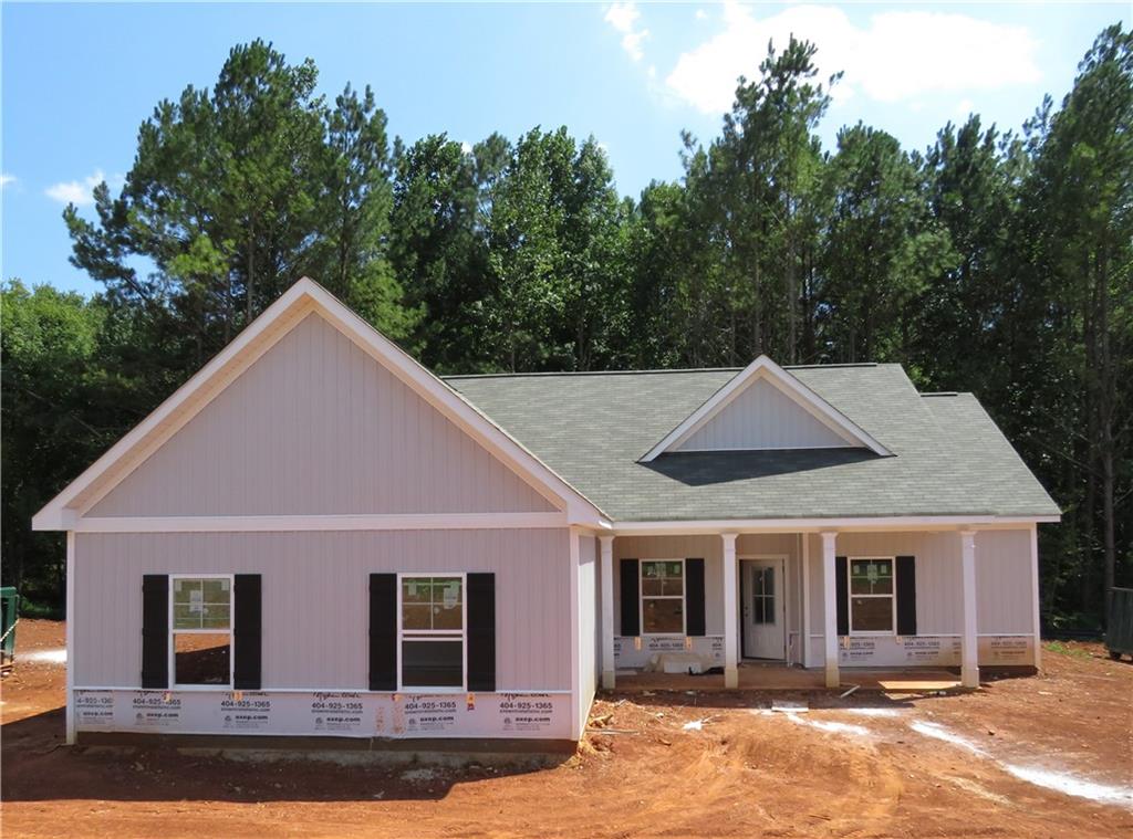 a front view of a house with yard