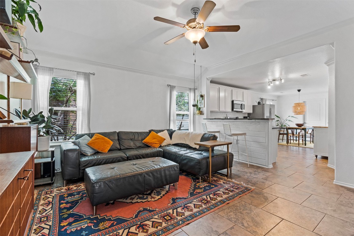 Open-concept living space featuring modern shelving and plenty of natural light.