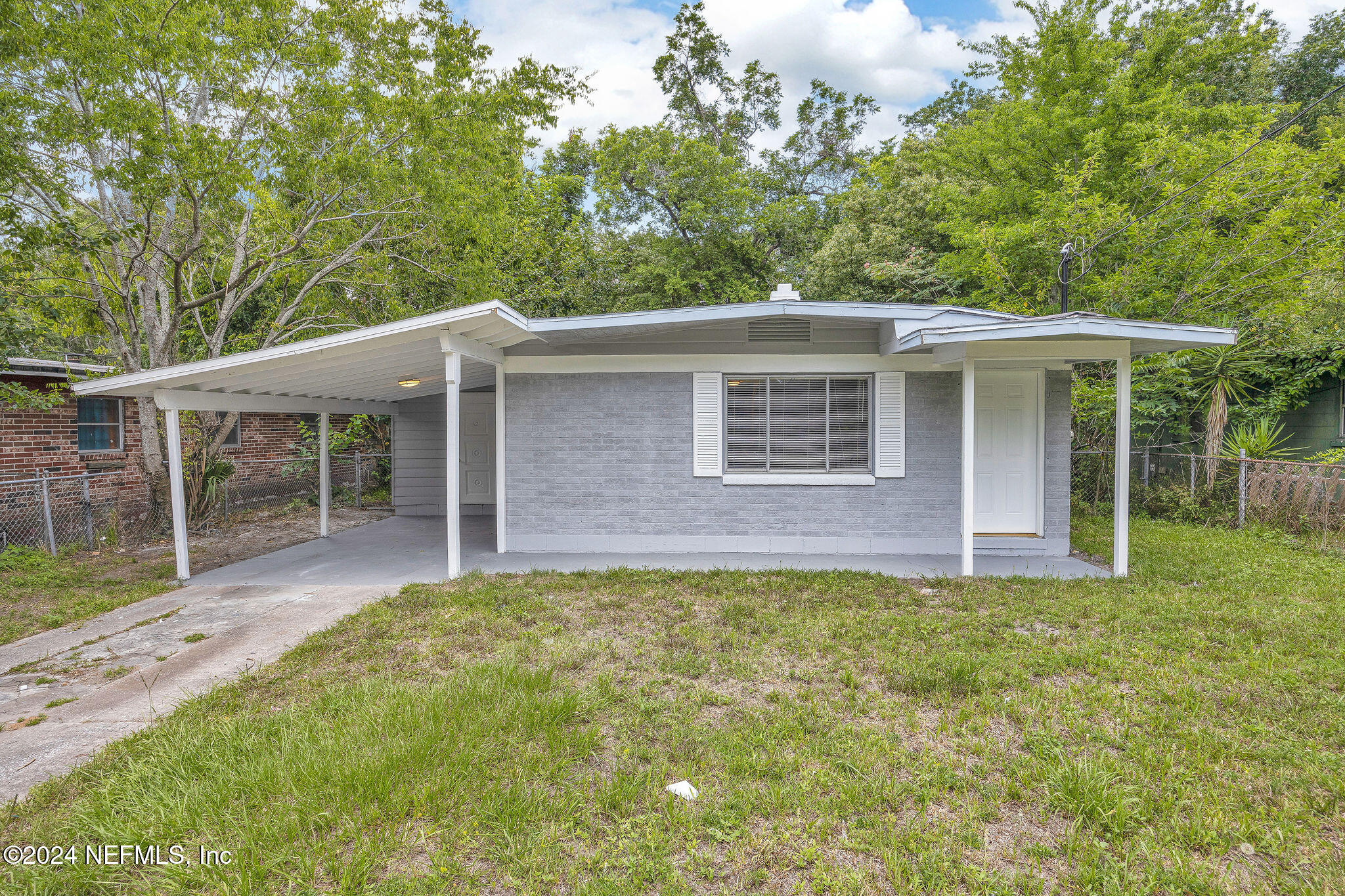 front view of a house with a yard