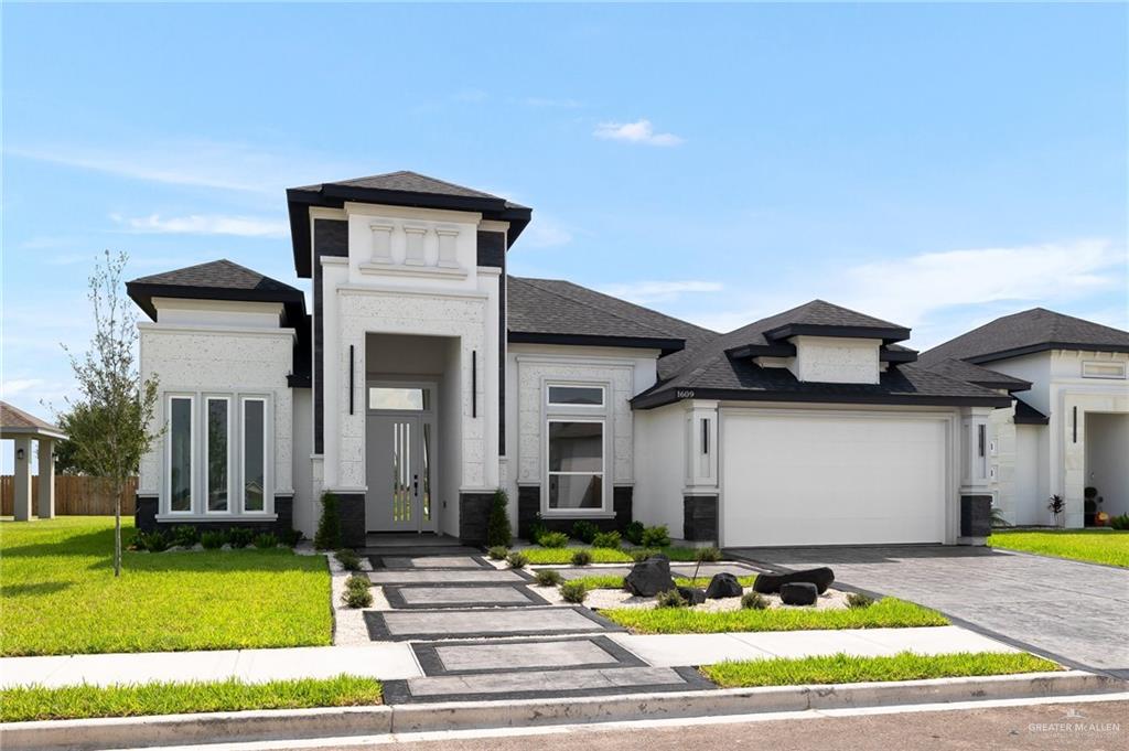 a front view of a house with garden