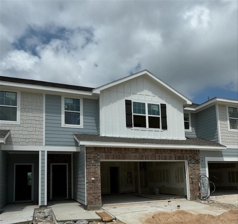 a front view of a house with garage