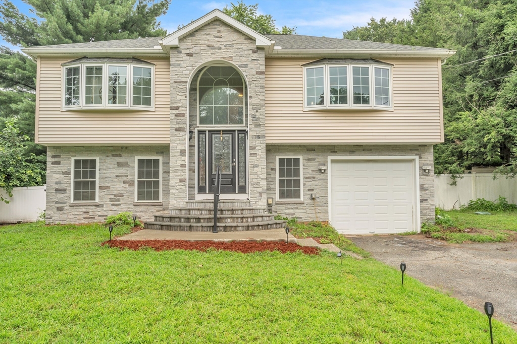 front view of a house with a yard