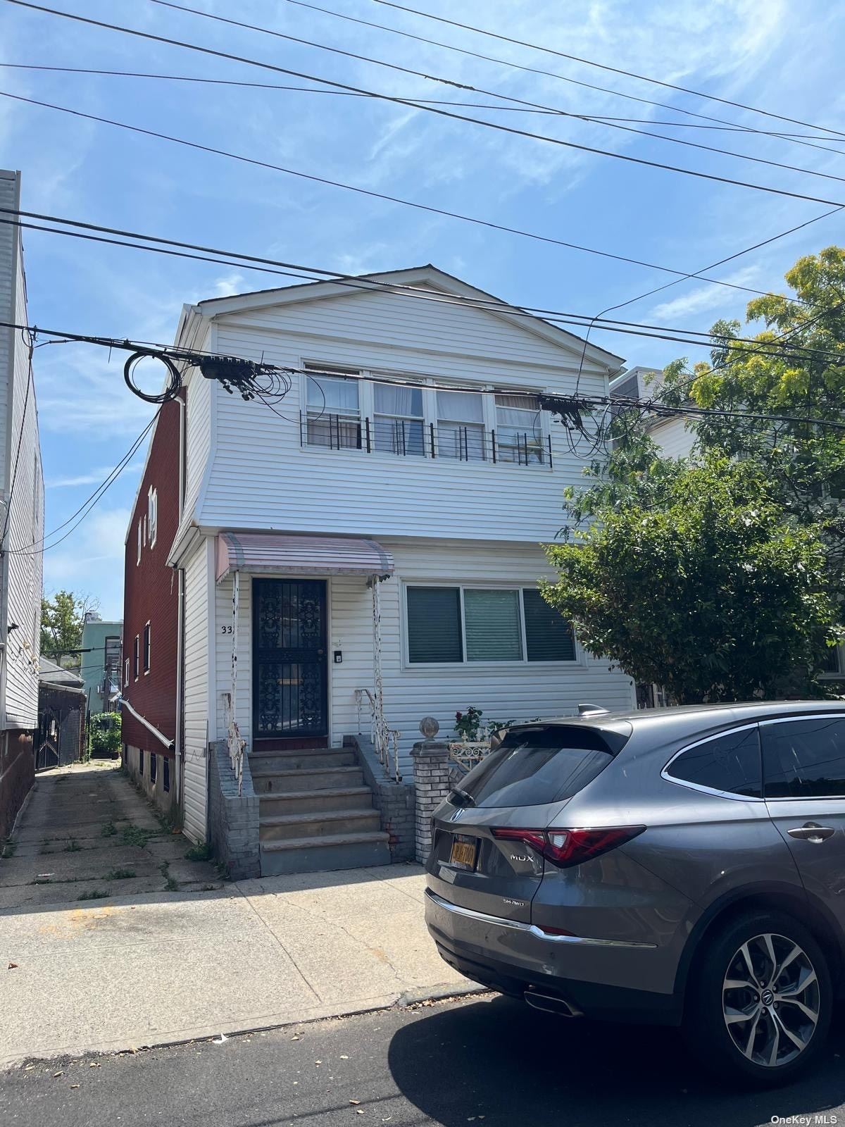 a front view of a house with parking space