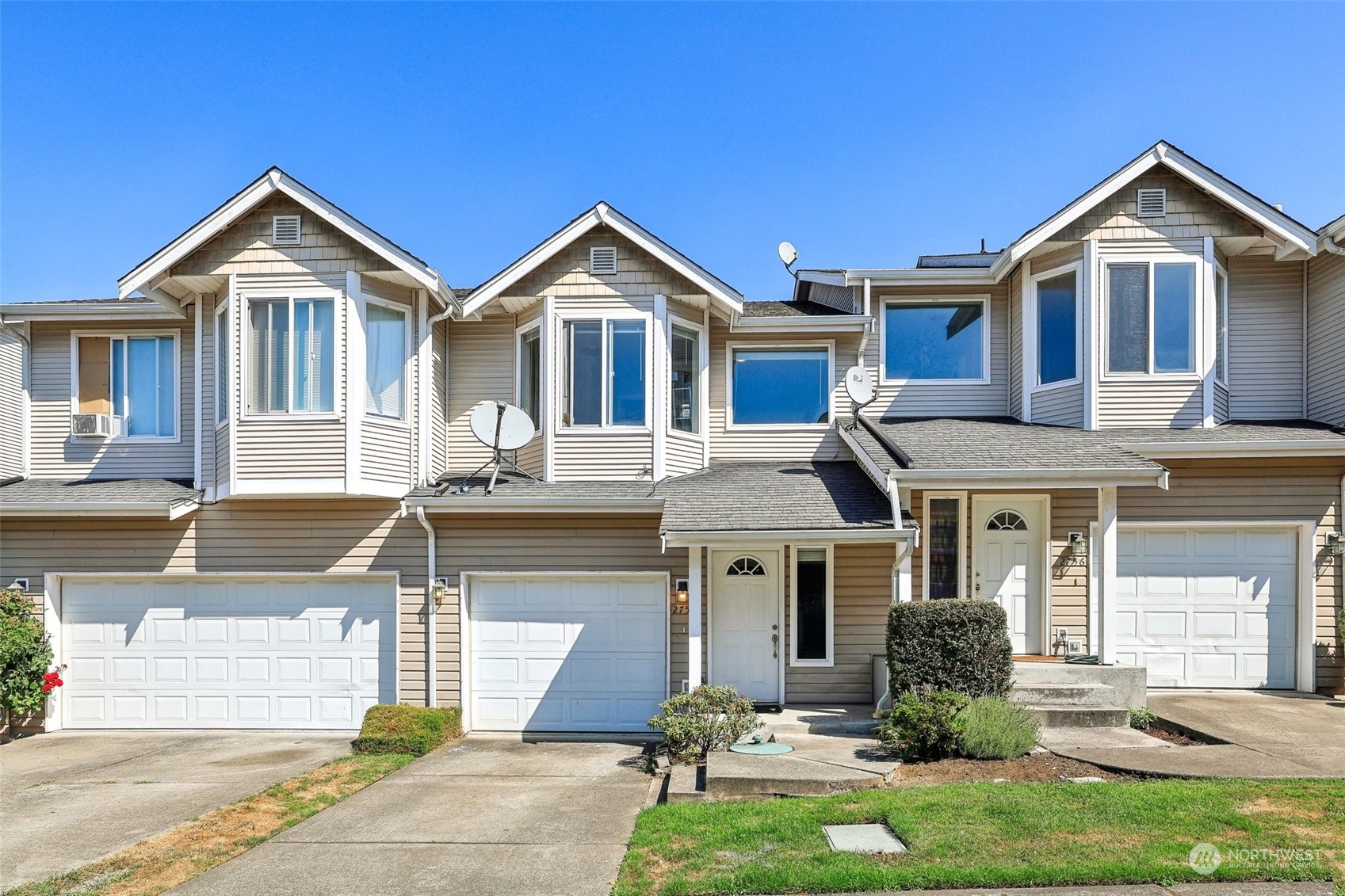 a front view of a house with a yard