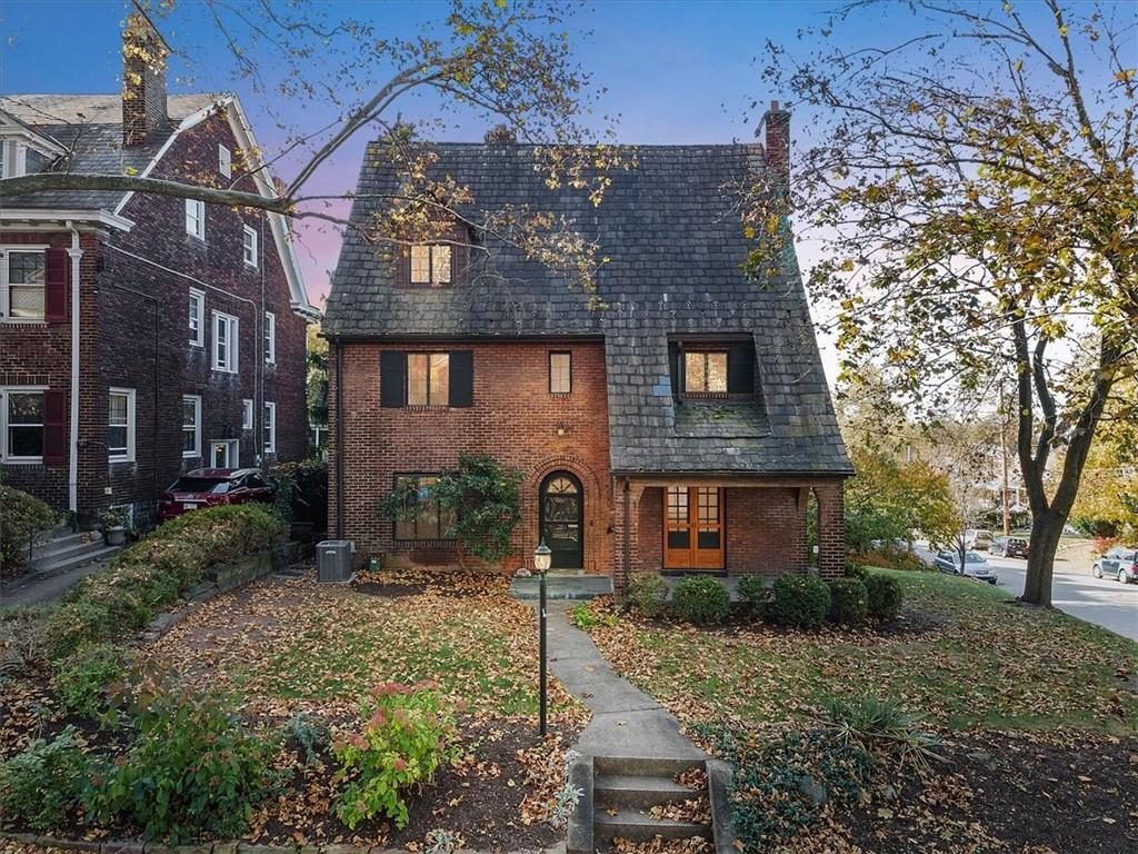 front view of a house with a yard