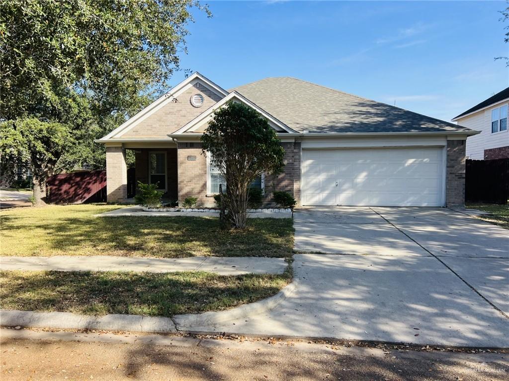 Single story home featuring a garage